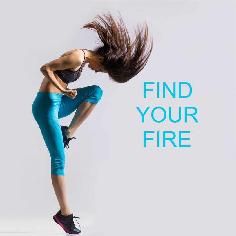 Beautiful young fit modern dancer lady in blue sportswear warming up working out dancing with her long hair flying full length studio image on gray background. Motivational phrase "Find your fire"