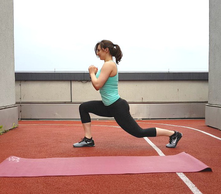 Girl performing the lunge exercise.