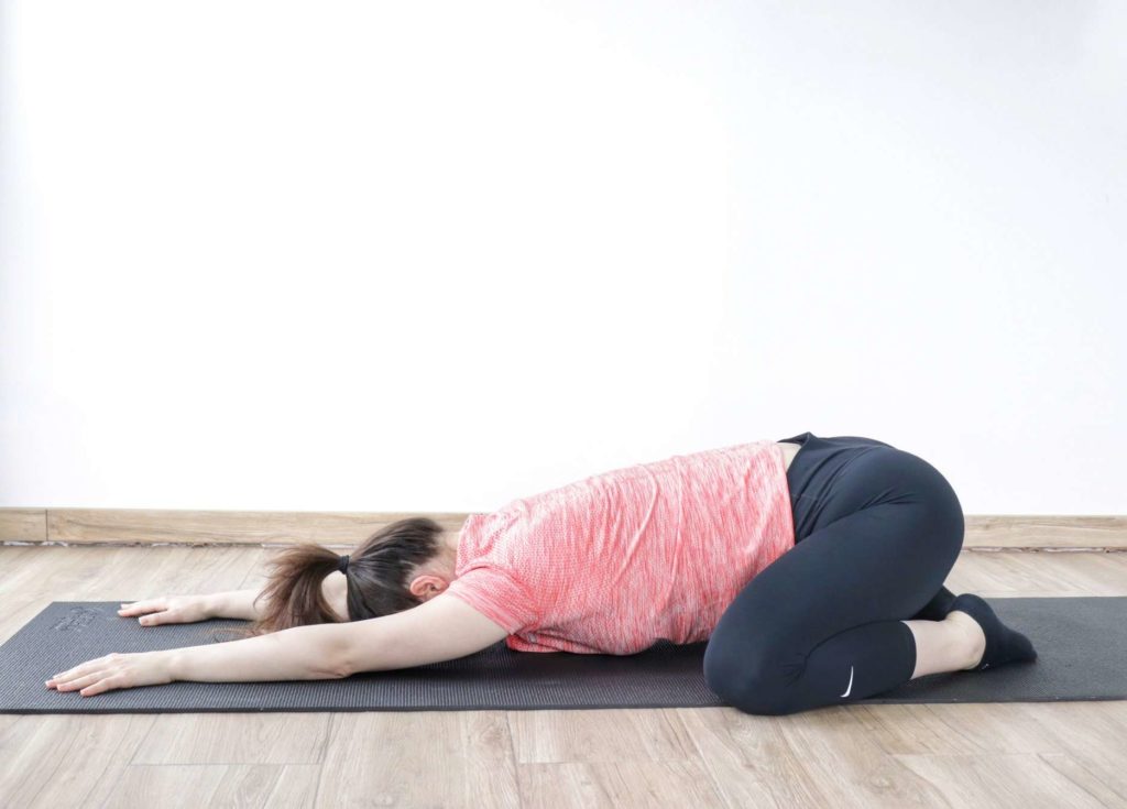 child's pose to ease lower back pain
