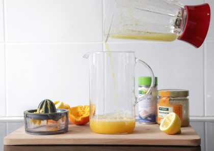 A homemade electrolyte drink made with lemons, oranges and ginger.