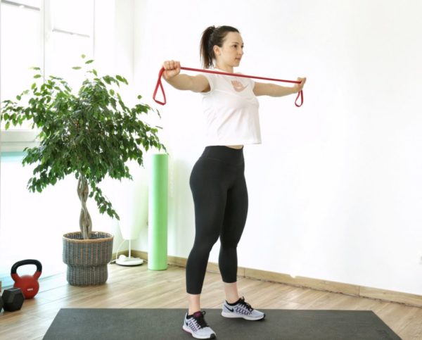 resistance band pull-aparts exercise part of an Resistance Band Upper-Body Home Workout