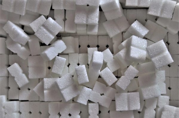 Sugar cubes demonstrate the amount of sugar in soda from article 5 Sneaky Habits That Prevent You From Losing Weight